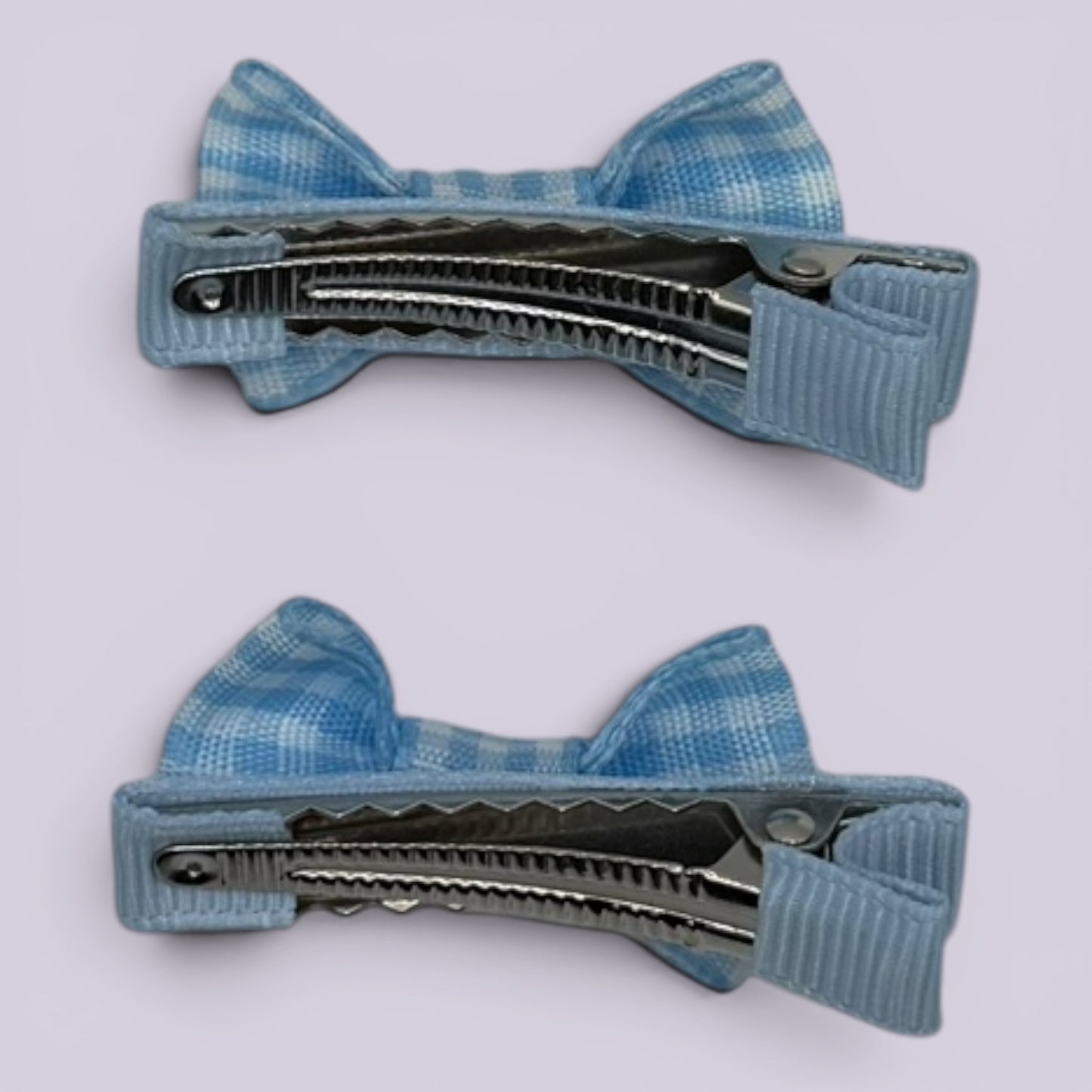 Light blue gingham mini bowtie clips on matching card