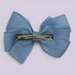 Light blue gingham pinwheel bow clip on matching card