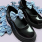 Light blue gingham shoe bows on school shoes