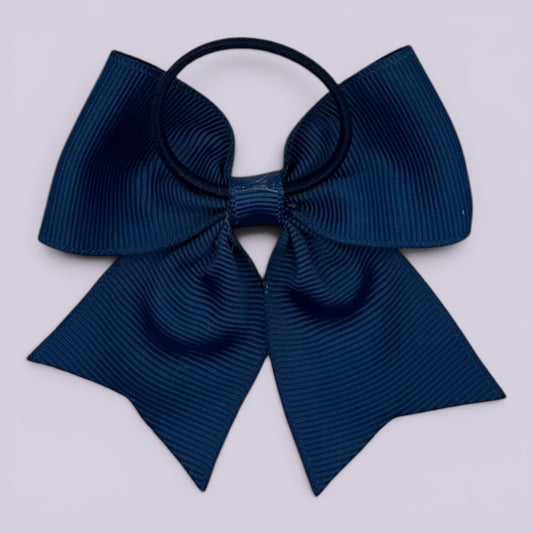Navy blue four tailed bow bobble on card