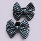 Navy blue gingham shoe bows close up