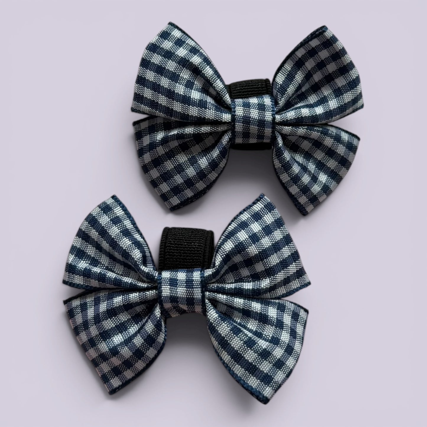 Navy blue gingham shoe bows close up