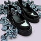 Navy blue gingham shoe bows on school shoes