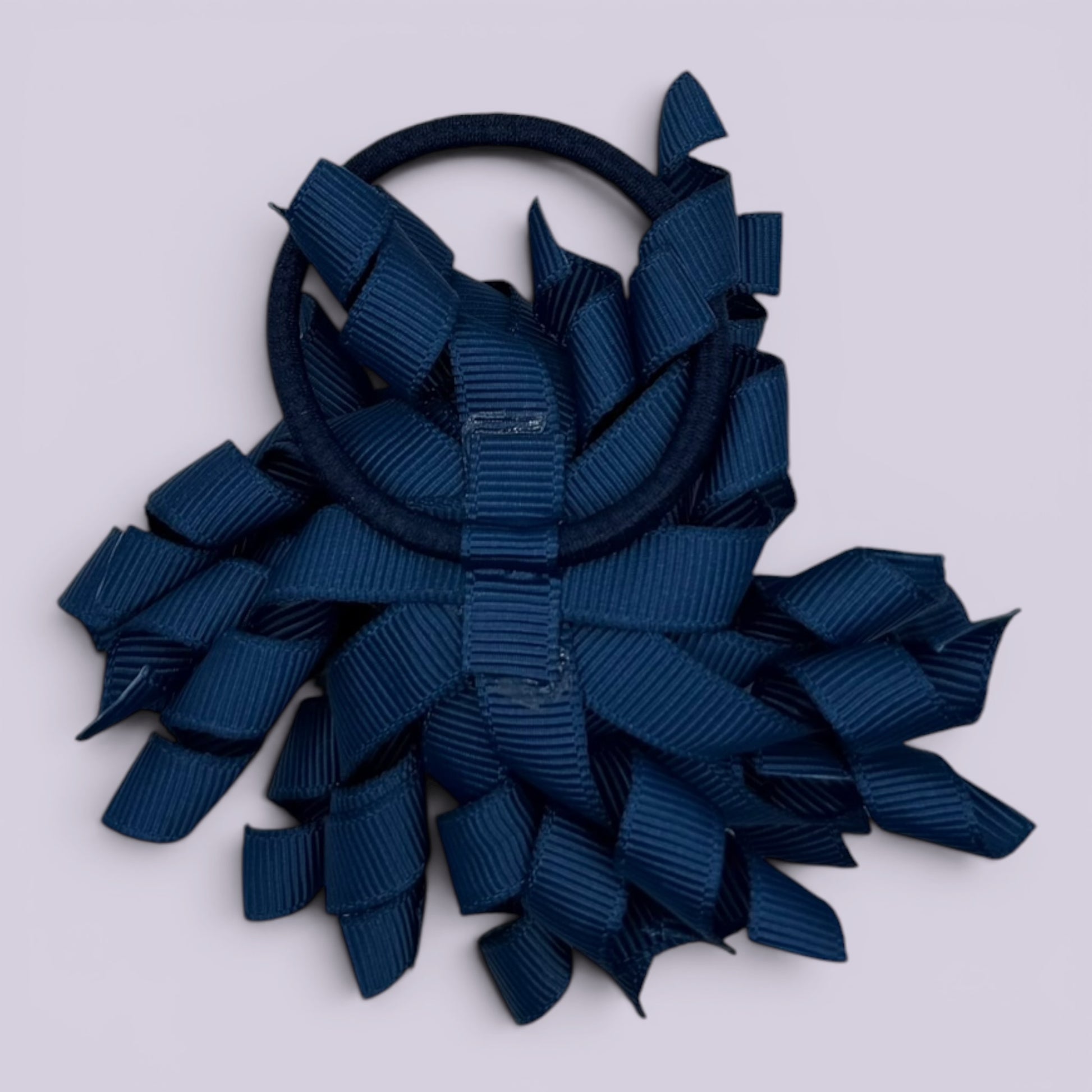 Navy blue korker bow bobble on card