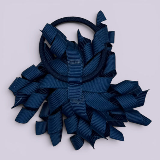 Navy blue korker bow bobble on card