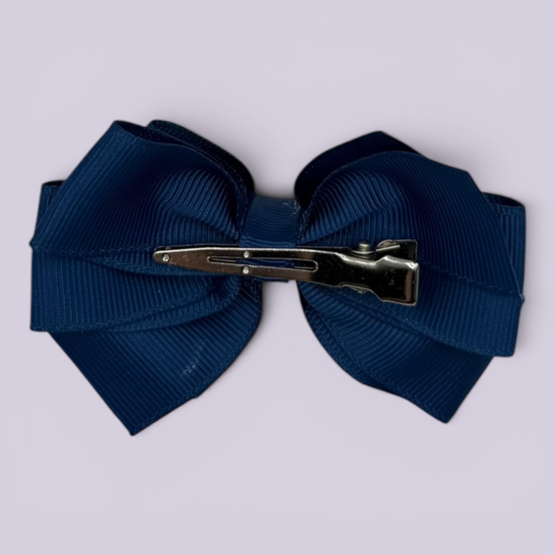 Navy blue pinwheel bow clip on card