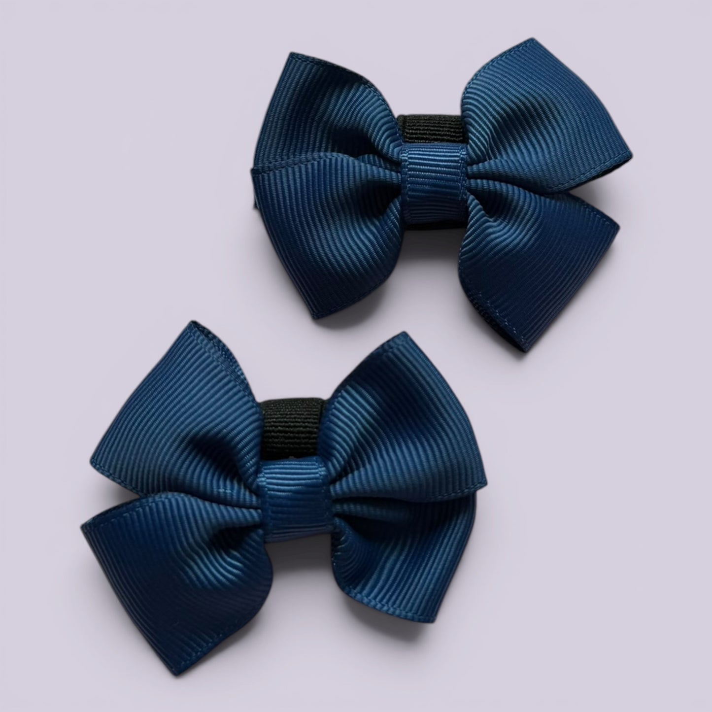 Navy blue shoe bows close up
