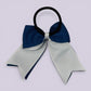 Navy blue and white bow bobble on card
