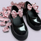 Pink gingham shoe bows on school shoes