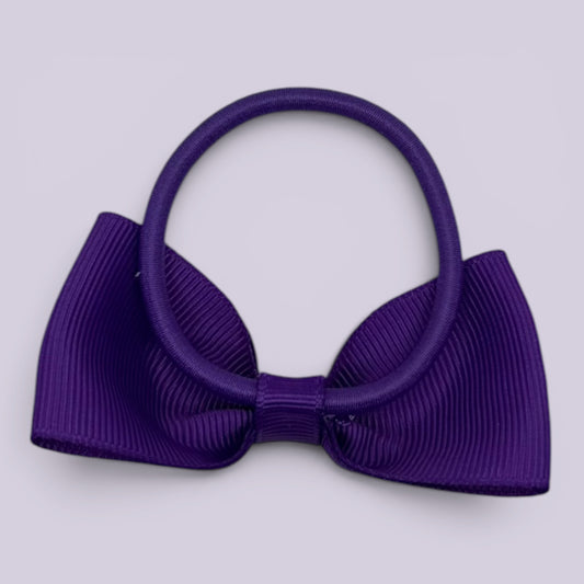 Purple bowtie bow bobble on card