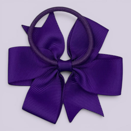 Purple pinwheel bow bobble on card