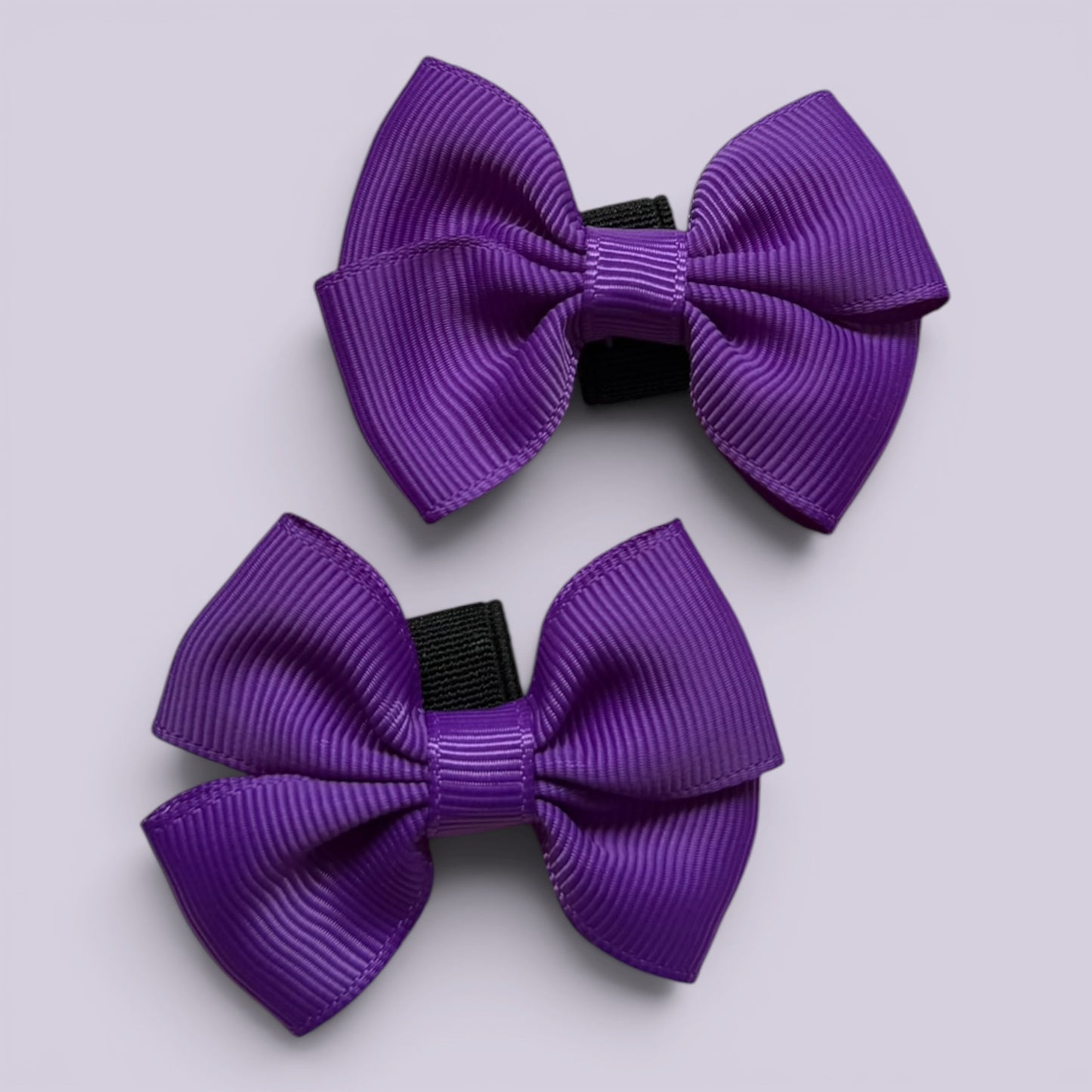 Purple shoe bows close up