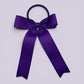 Purple tailed bow bobble on card