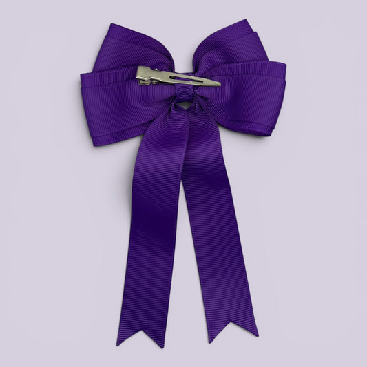 Purple tailed bow clip on card