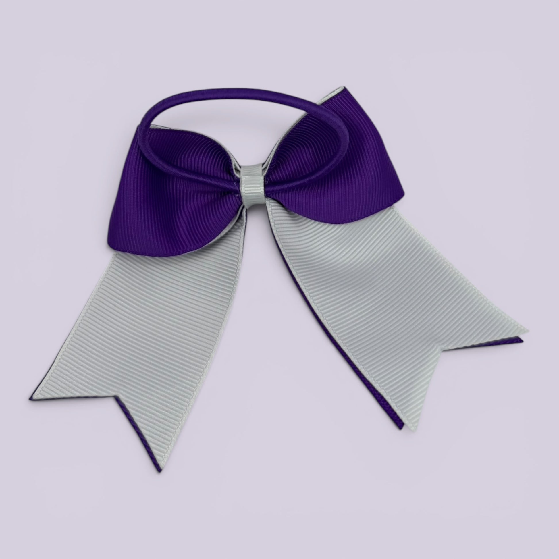 Purple and white bow bobble on card