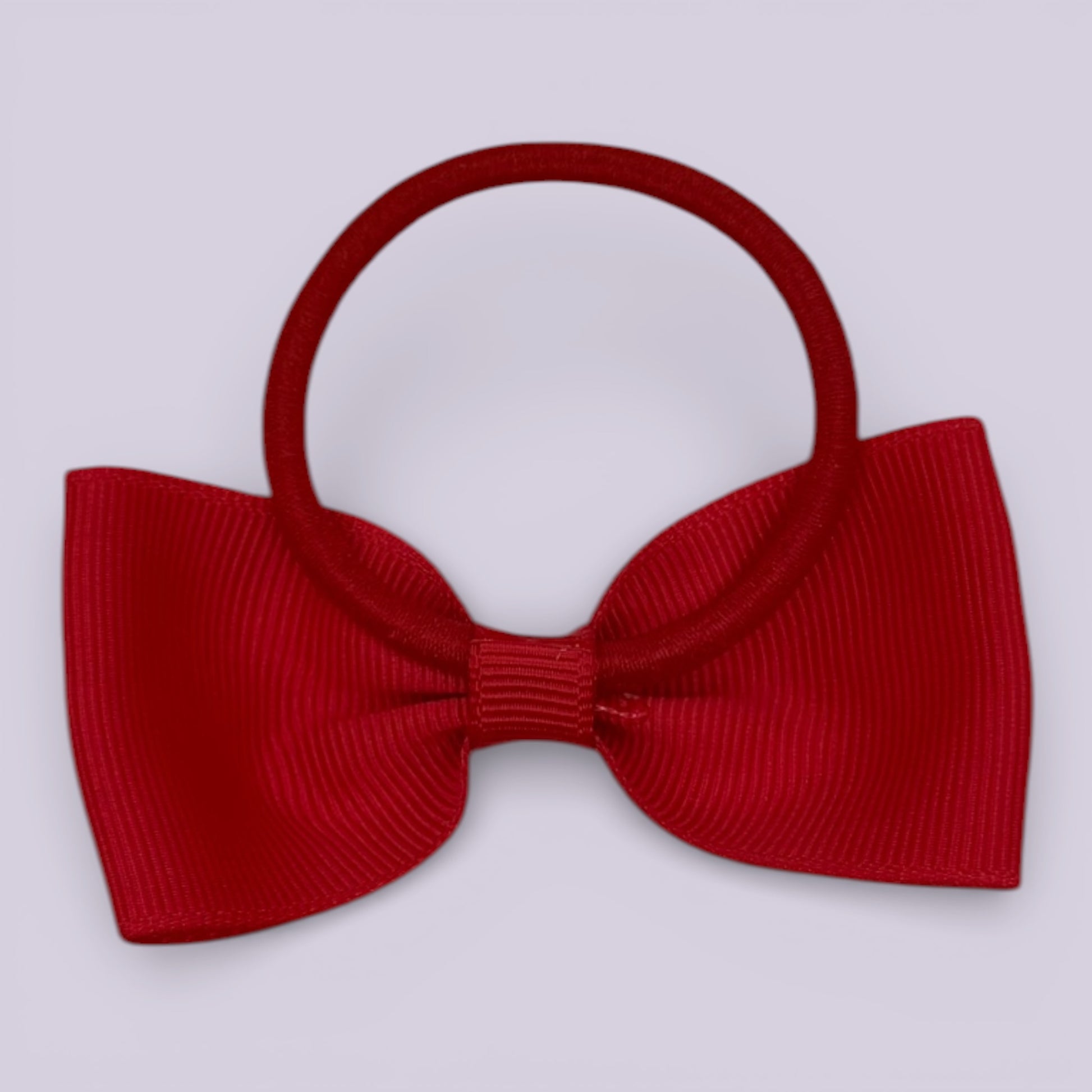 Red bowtie bow bobble on card