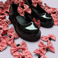 Red gingham shoe bows on school shoes