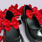 Red school uniform shoe bows