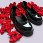 Red shoe bows on school shoes