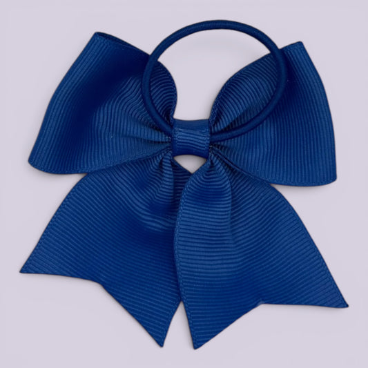 Royal blue four tailed bow bobble on card