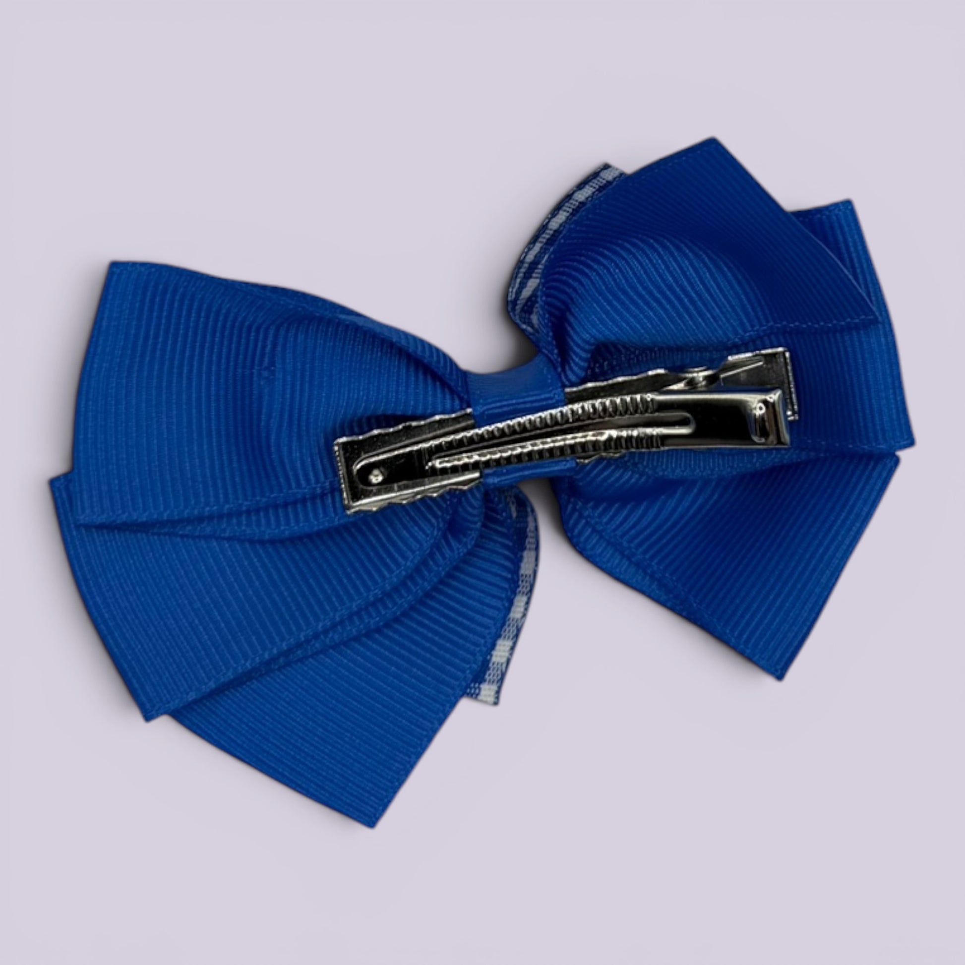 Royal blue gingham pinwheel bow clip on card