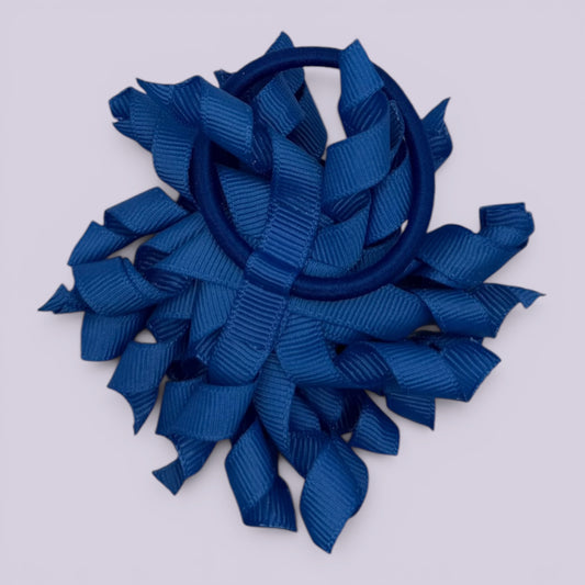 Royal blue korker bow bobble on card