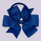 Royal blue pinwheel bow bobble on card