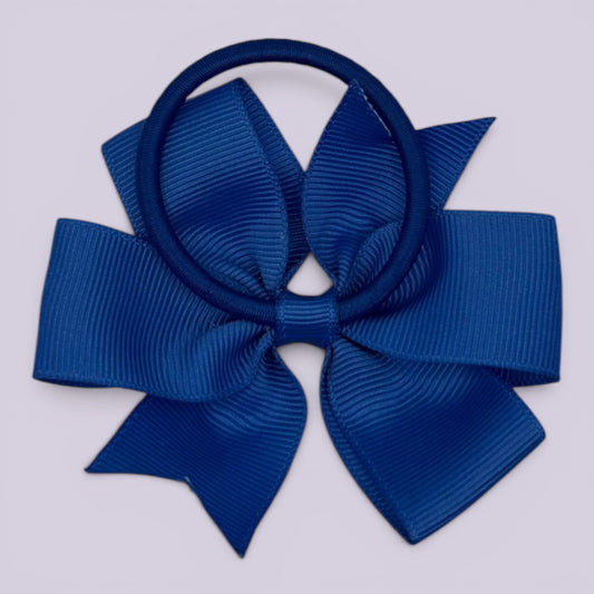 Royal blue pinwheel bow bobble on card