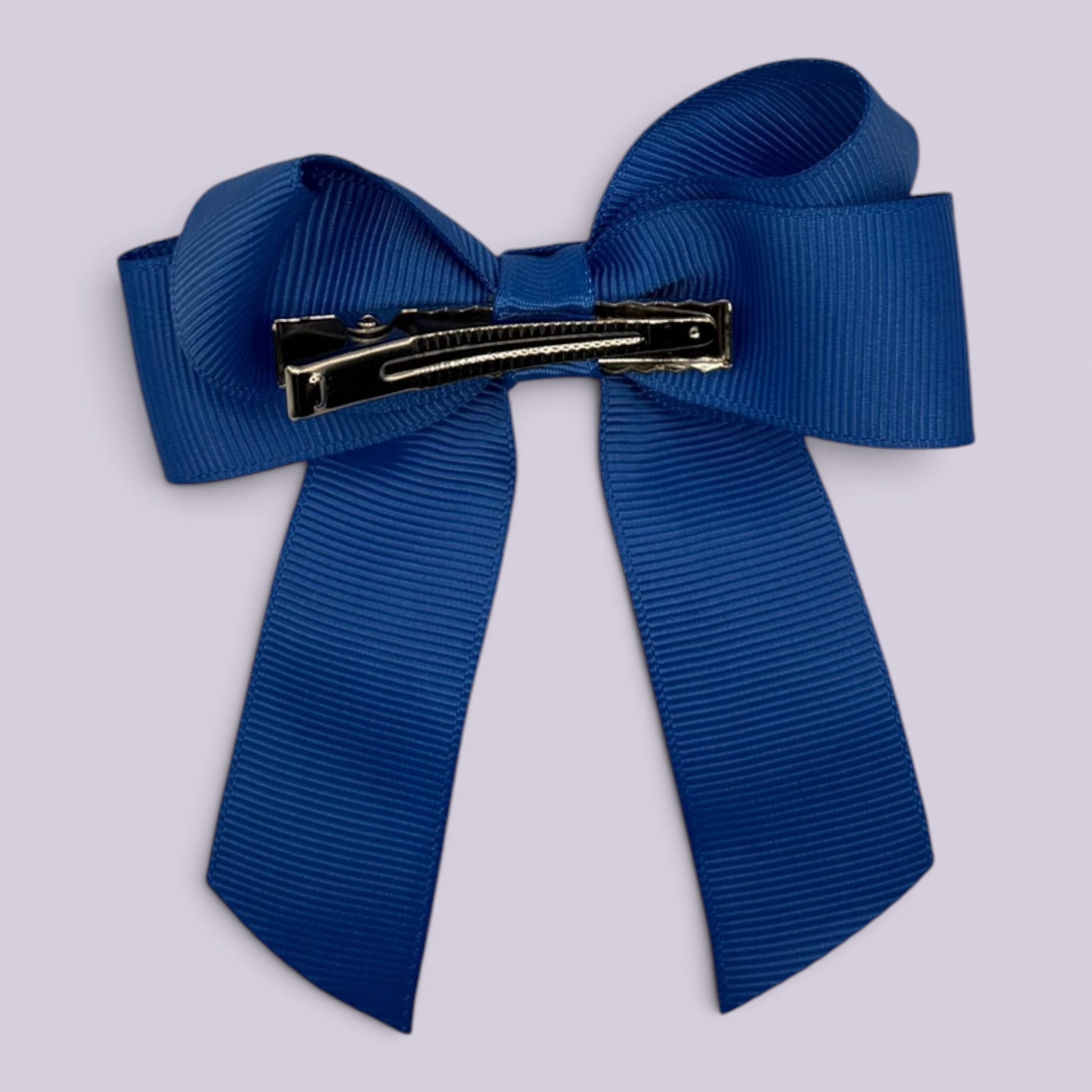 Royal blue tailed bow clip on card