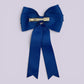 Royal blue tailed bow clip on card