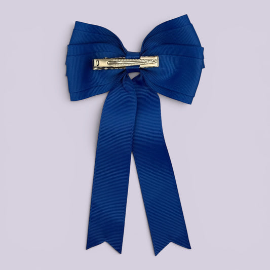 Royal blue tailed bow clip on card