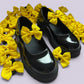 Yellow shoe bows on school shoes